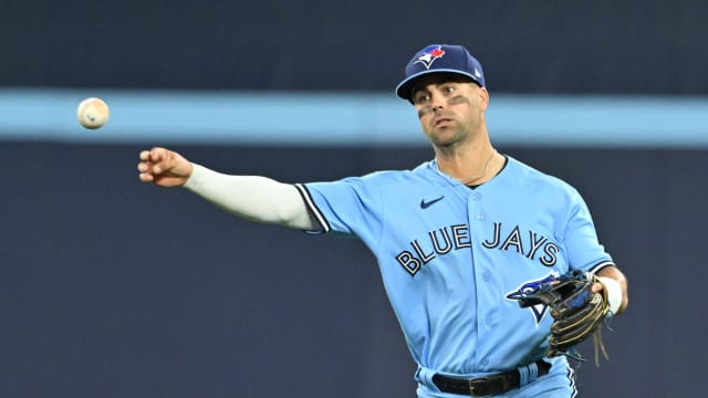 Aug 28, 2023; Toronto, Ontario, CAN; Toronto Blue Jays second baseman Whit Merrifield (15) throws out Washington Nationals first baseman Dominic Smith (not pictured) in the eighth inning at Rogers Centre.